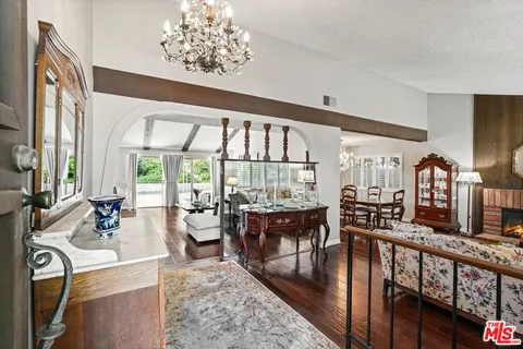 a very nice looking living room with furniture and a large window