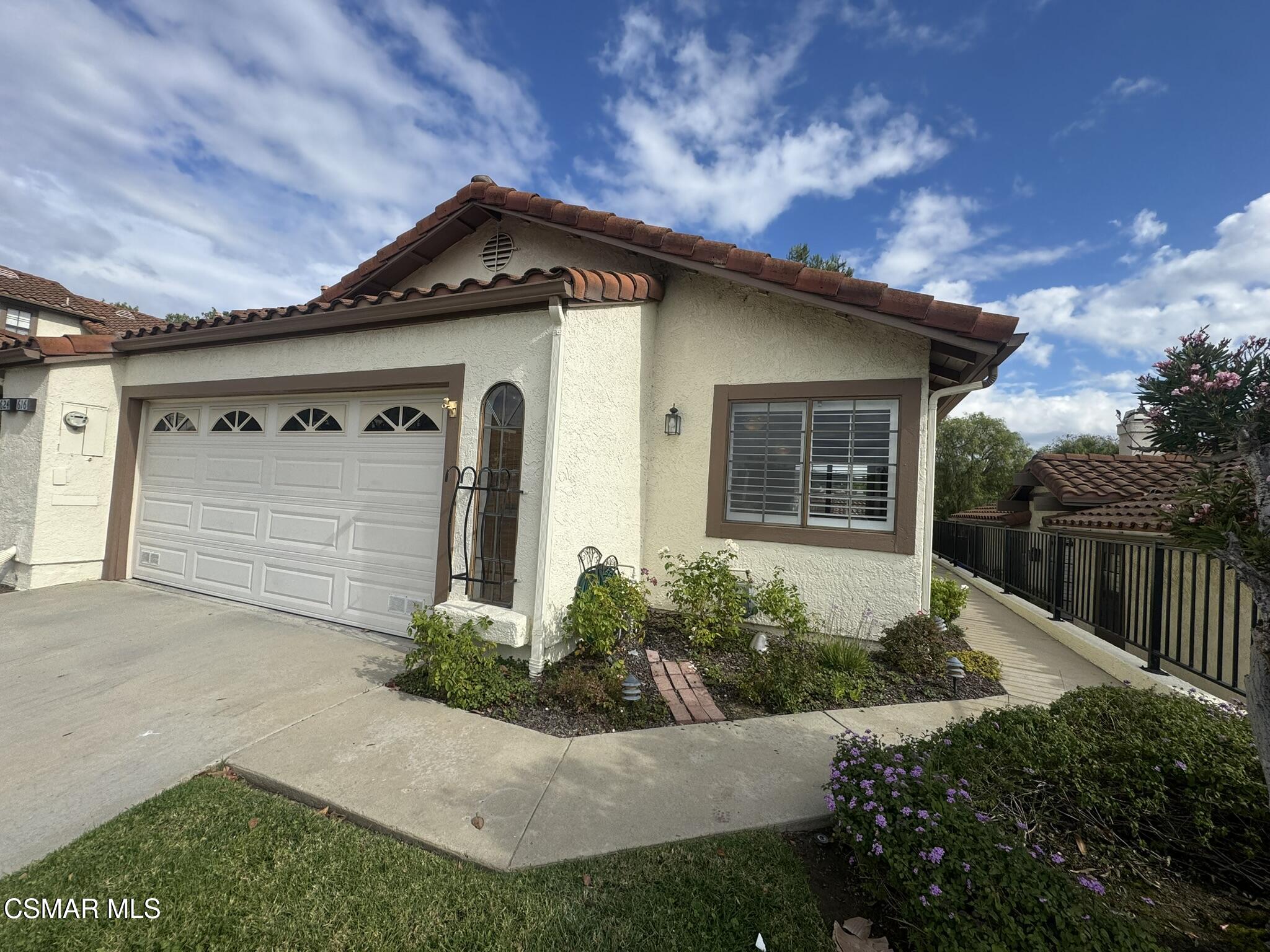 616 Cartpath Place Simi Valley, CA 93065 - Photo 1 of 17 a front view of a house with a yard