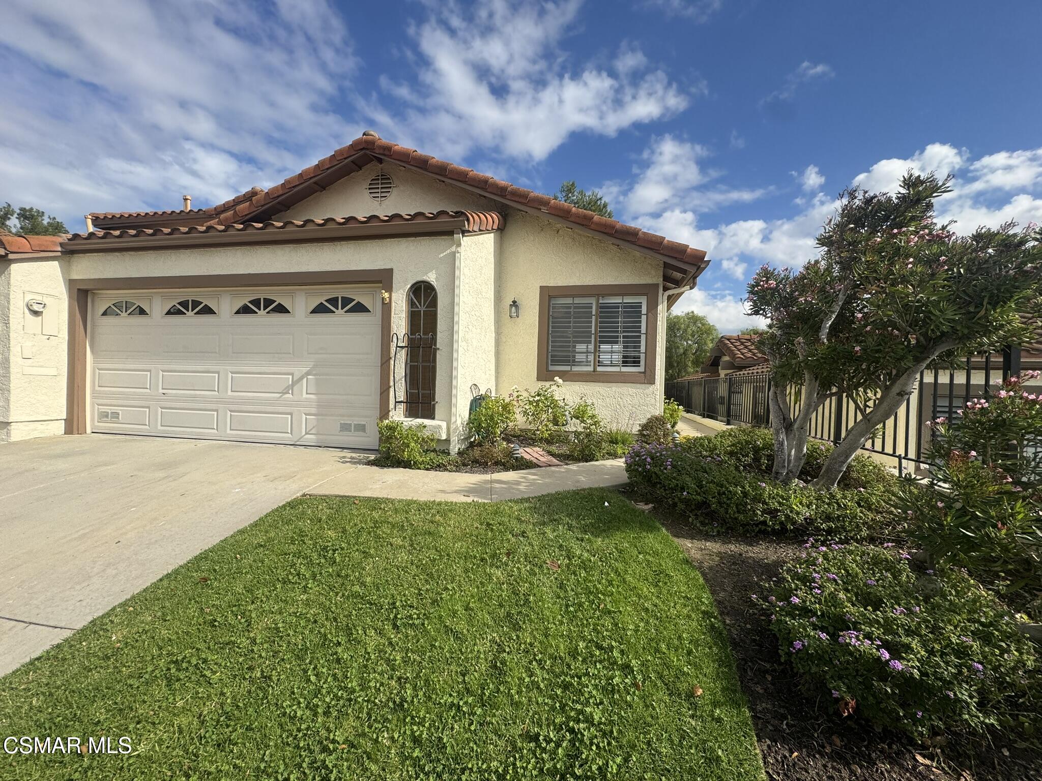 616 Cartpath Place Simi Valley, CA 93065 - Photo 2 of 17 a front view of a house with garden