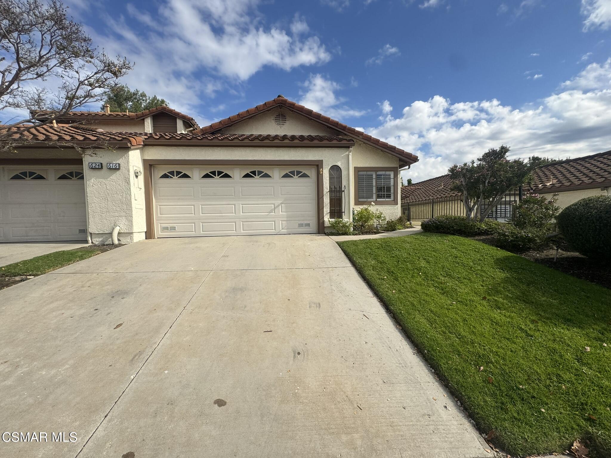 616 Cartpath Place Simi Valley, CA 93065 - Photo 3 of 17 a front view of a house with garden