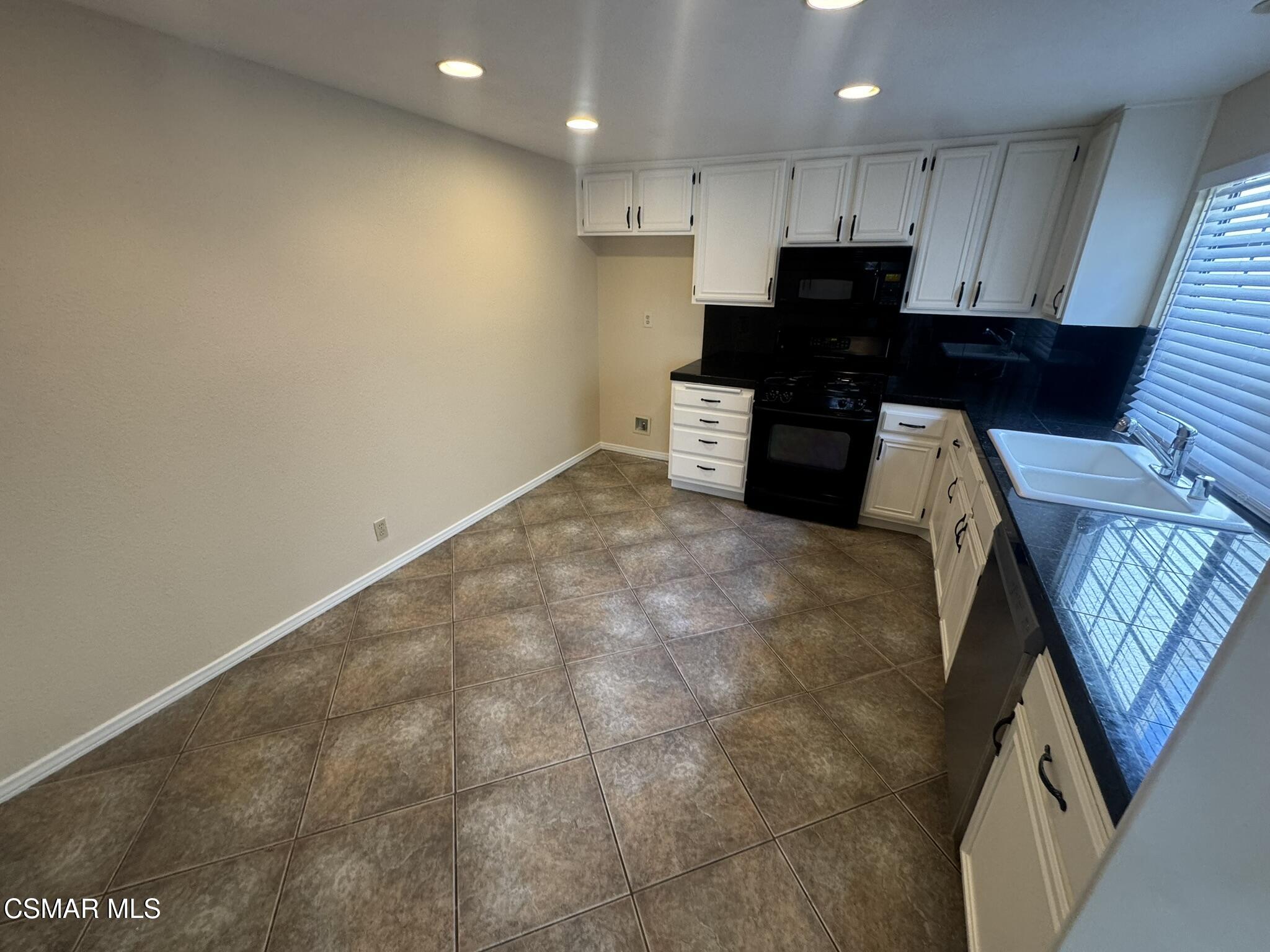 616 Cartpath Place Simi Valley, CA 93065 - Photo 10 of 17 a view of kitchen with refrigerator stove and cabinets