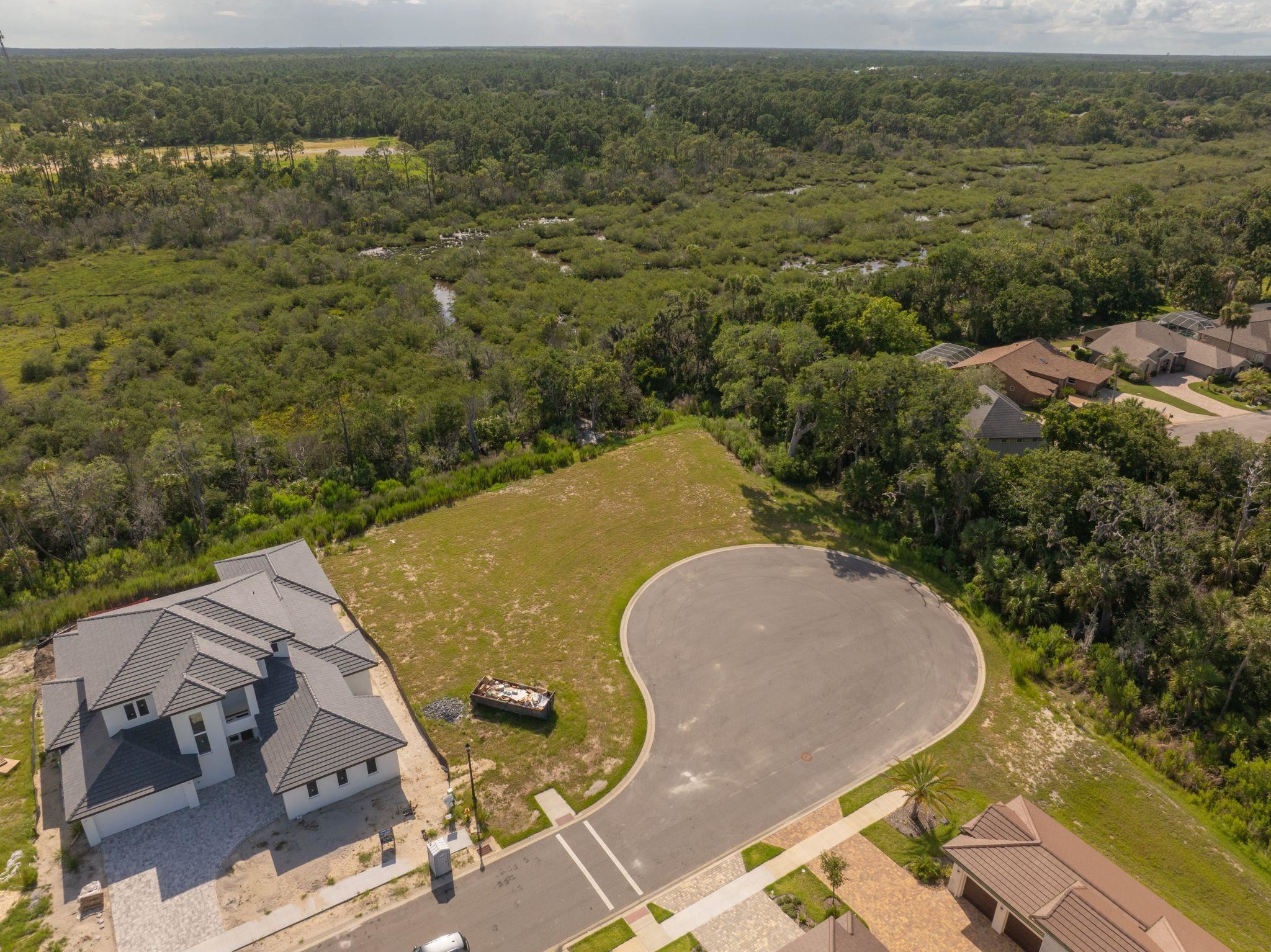 5 Coronado Road Flagler Beach, FL 32136 - Photo 16 of 18 an aerial view of a house with a yard