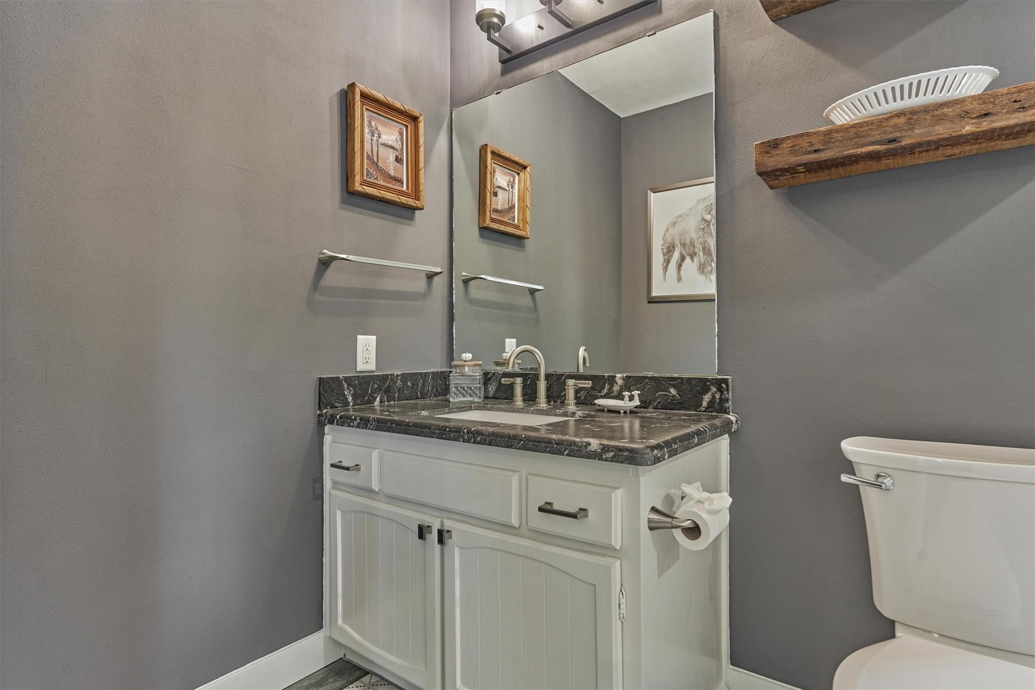 1 April Point Drive South Montgomery, TX 77356 - Photo 27 of 45 a bathroom with a granite countertop toilet sink and mirror