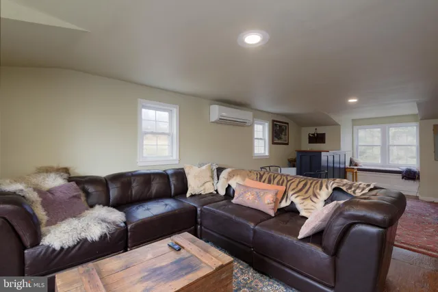 a view of a dining room with furniture wooden floor and front door
