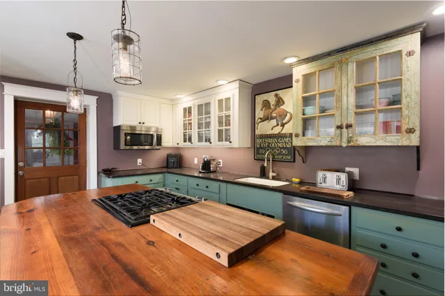 a kitchen with a stove a refrigerator a oven and a refrigerator