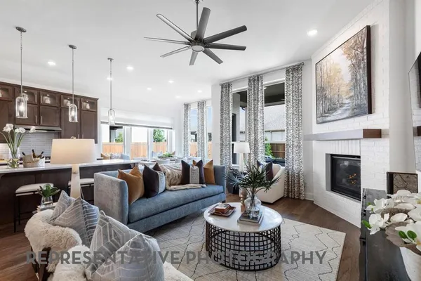a living room with furniture fireplace and window