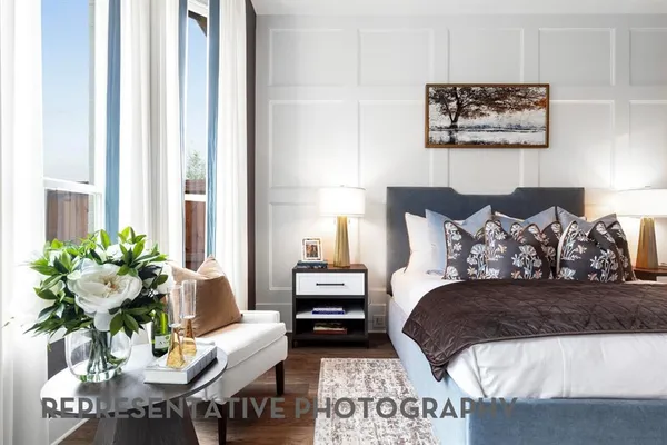 a bedroom with a bed and a couch