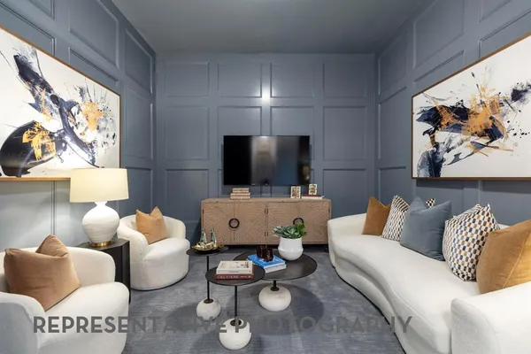 a living room with furniture and a chandelier