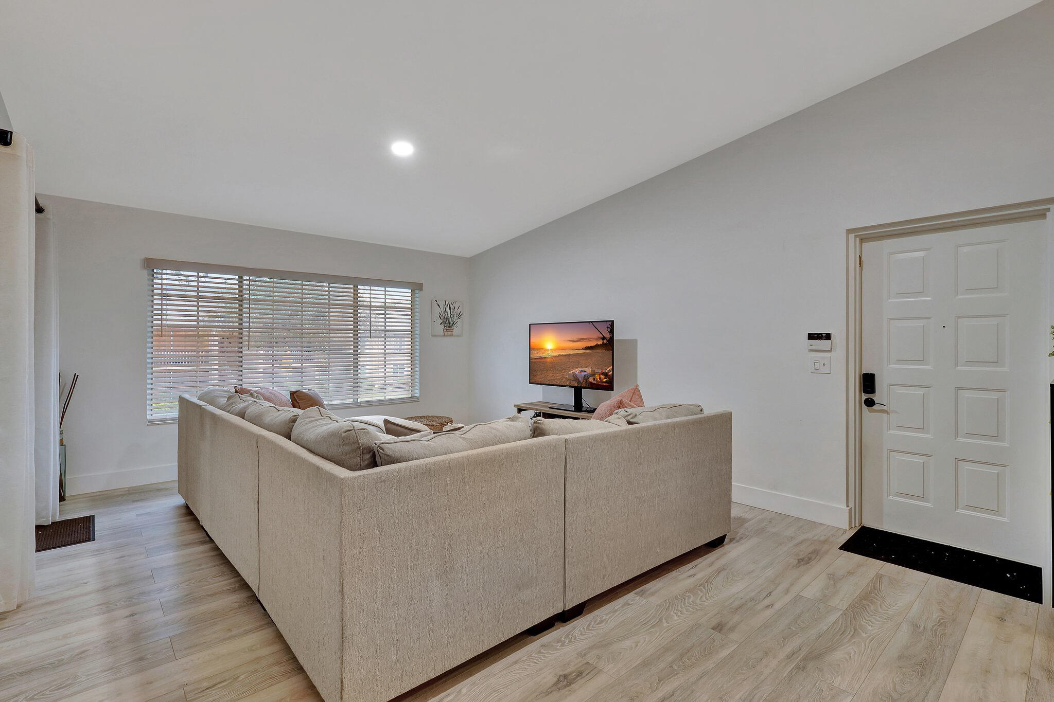 13851 Oneida Drive, Unit B2 Delray Beach, FL 33446 - Photo 12 of 30 a living room with furniture and a flat screen tv