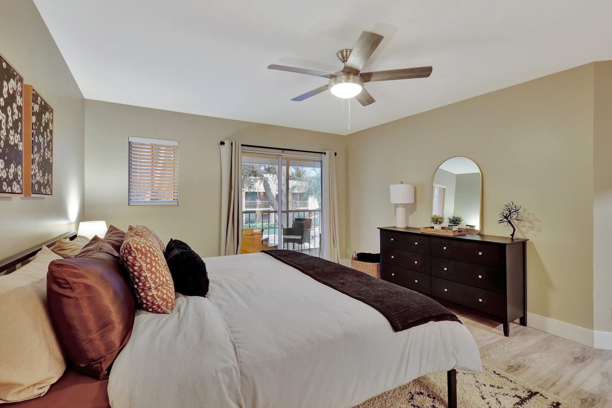 13851 Oneida Drive, Unit B2 Delray Beach, FL 33446 - Photo 15 of 30 a bedroom with a bed and a window