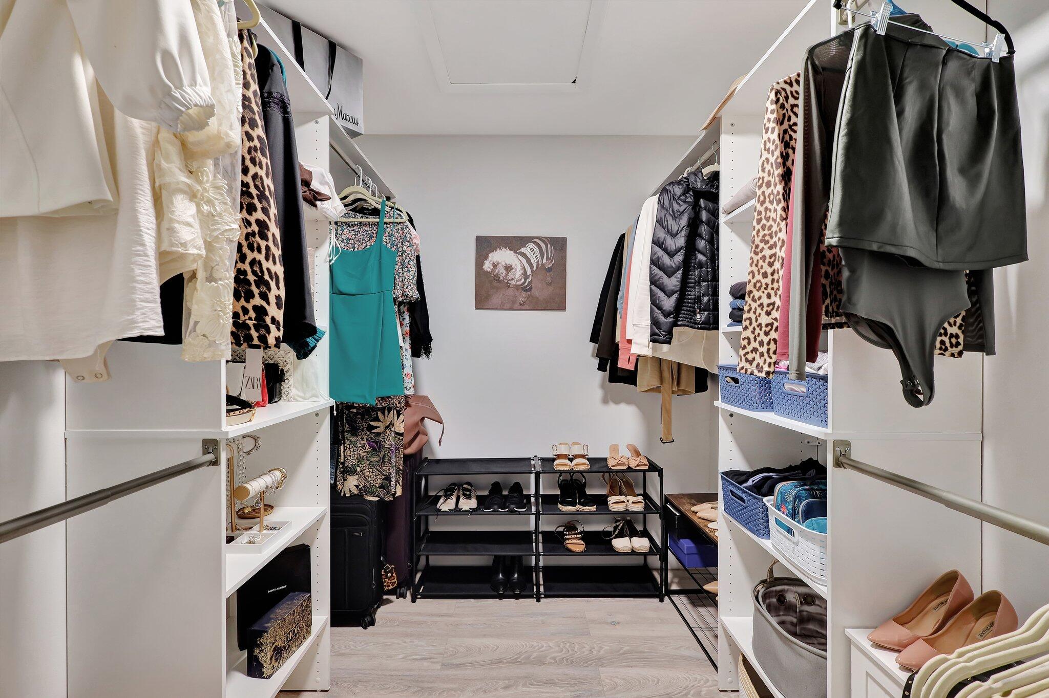 13851 Oneida Drive, Unit B2 Delray Beach, FL 33446 - Photo 16 of 30 a view of walk in closet with clothes and shoes