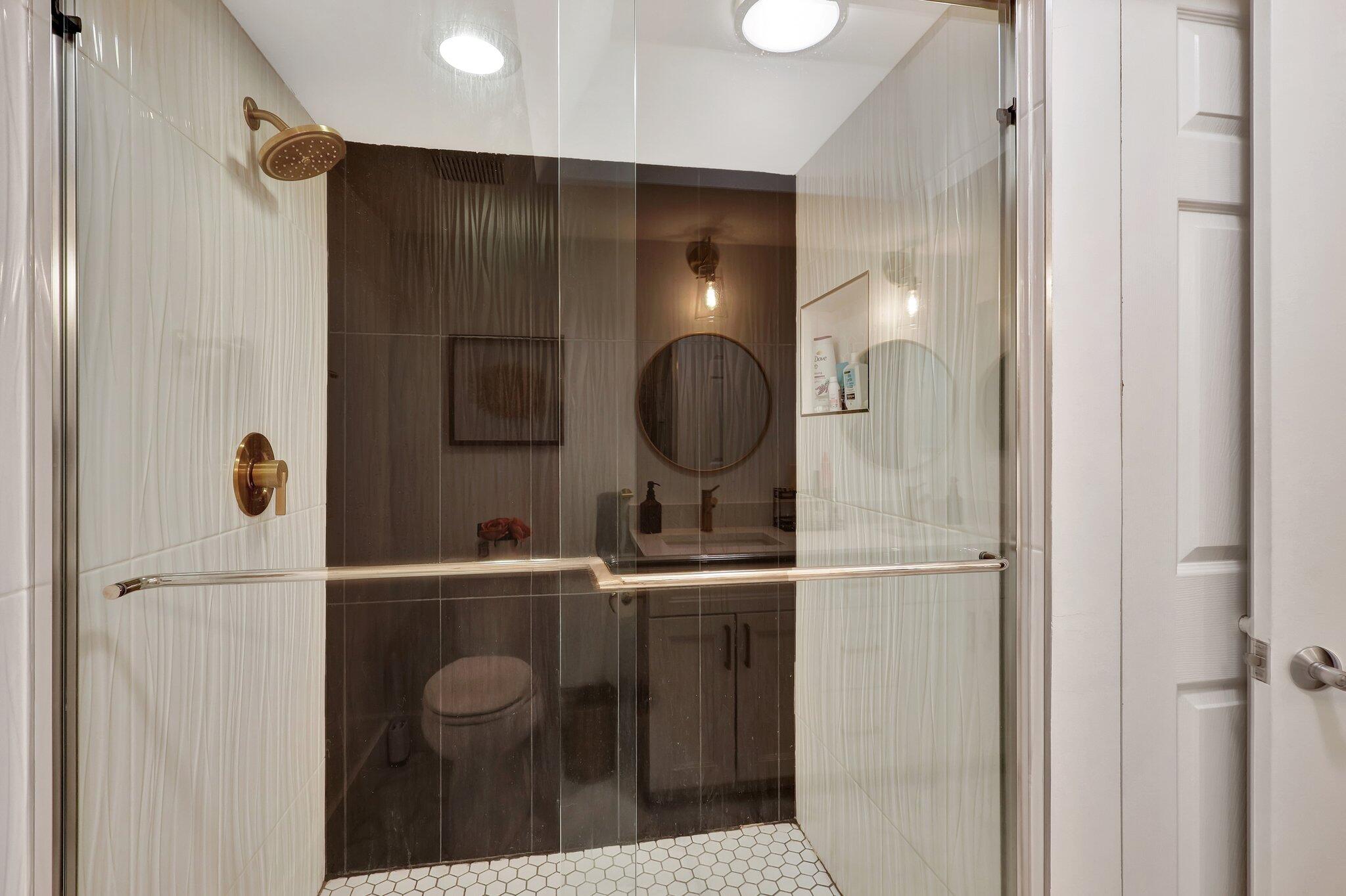 13851 Oneida Drive, Unit B2 Delray Beach, FL 33446 - Photo 18 of 30 a bathroom with a mirror and a sink