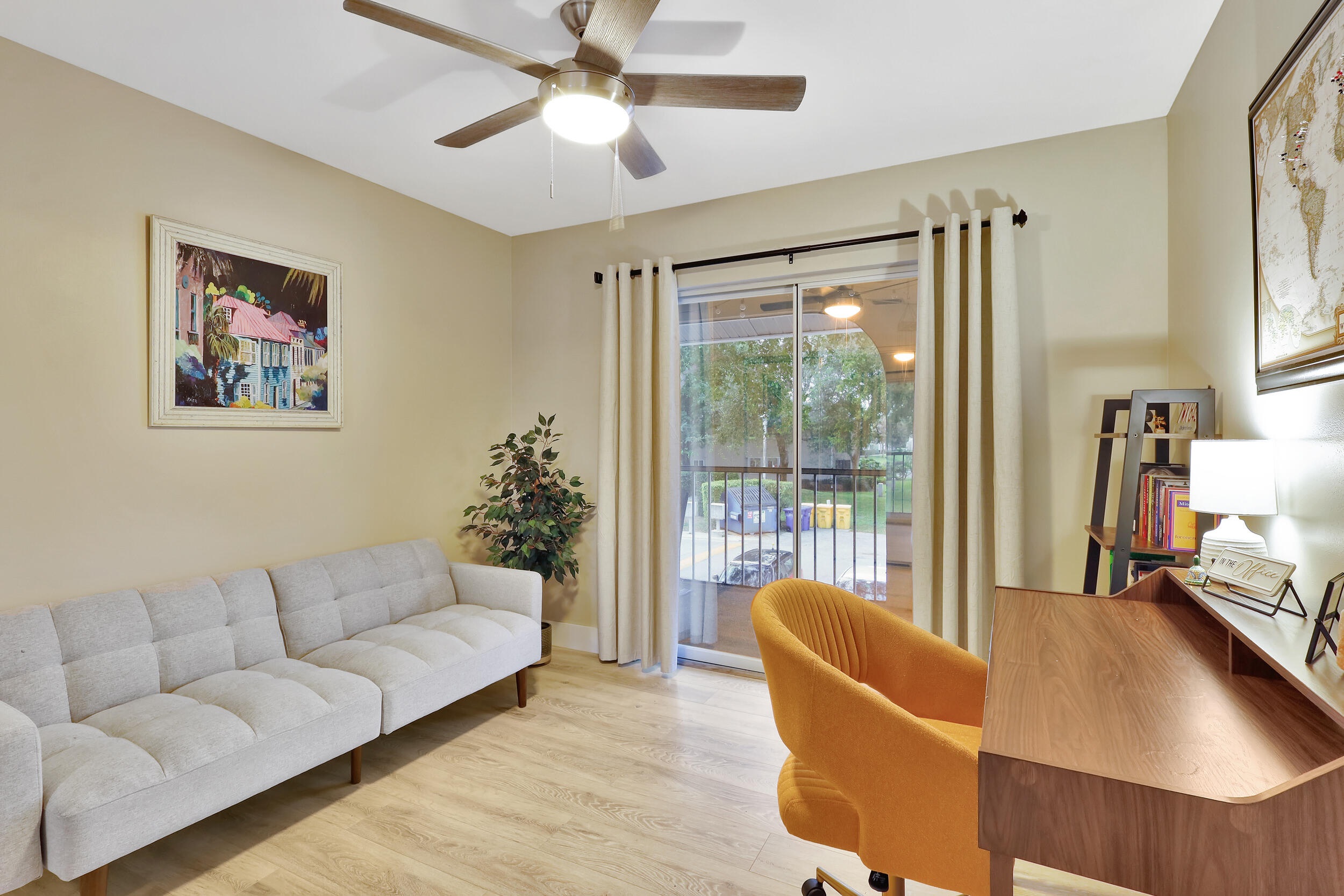 13851 Oneida Drive, Unit B2 Delray Beach, FL 33446 - Photo 23 of 30 a living room with furniture and a large window