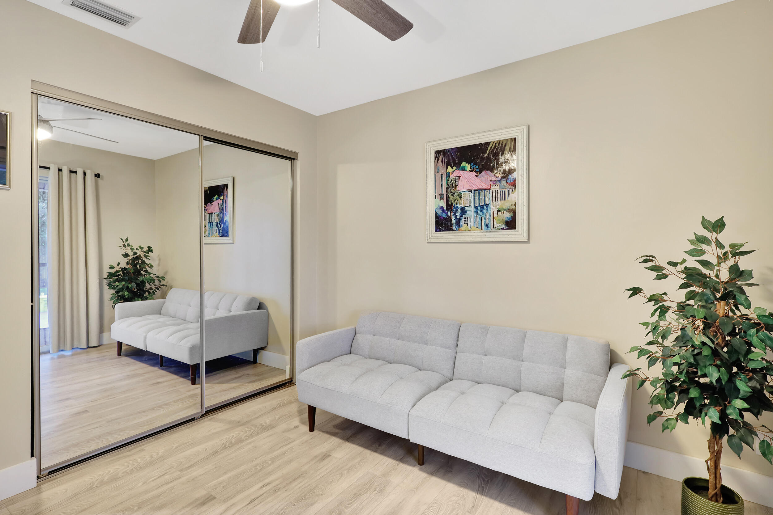 13851 Oneida Drive, Unit B2 Delray Beach, FL 33446 - Photo 24 of 30 a living room with furniture and a potted plant