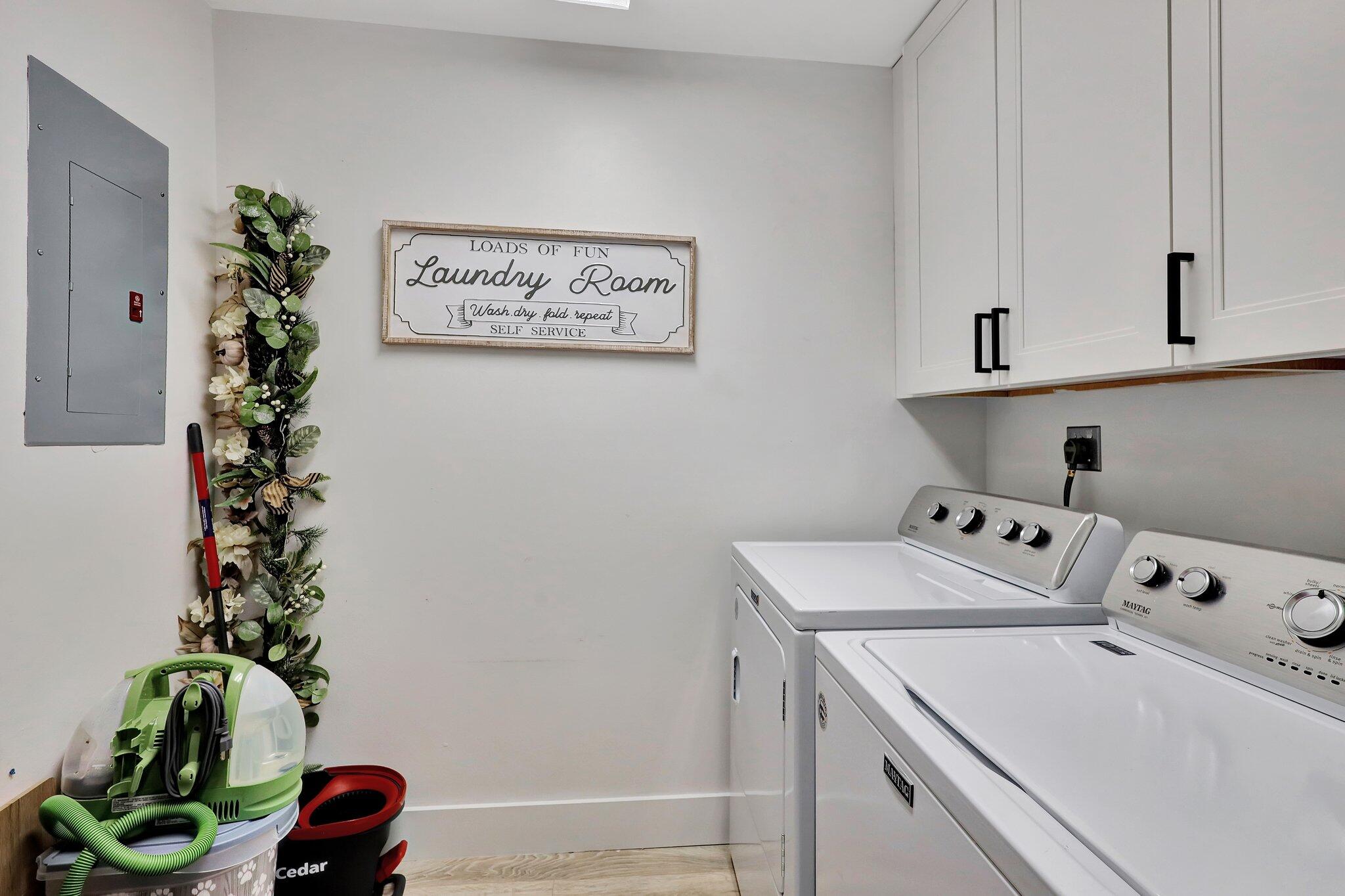 13851 Oneida Drive, Unit B2 Delray Beach, FL 33446 - Photo 26 of 30 a utility room with dryer and flower pot
