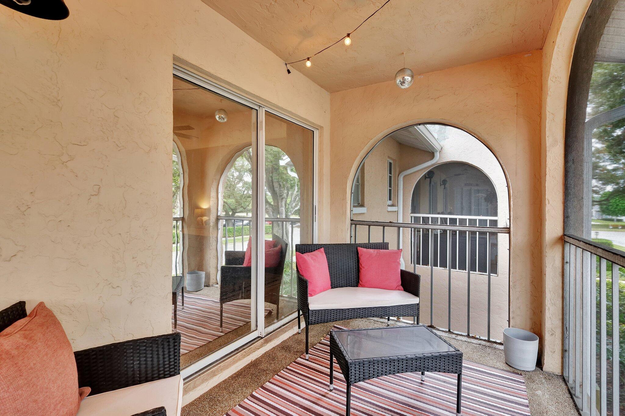 13851 Oneida Drive, Unit B2 Delray Beach, FL 33446 - Photo 28 of 30 a living room with furniture and a window