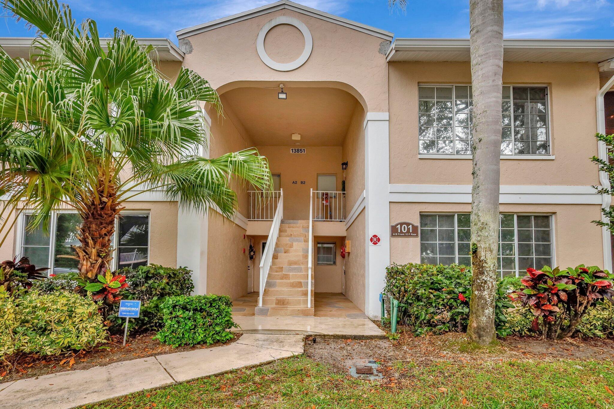 13851 Oneida Drive, Unit B2 Delray Beach, FL 33446 - Photo 30 of 30 a front view of a house with a yard