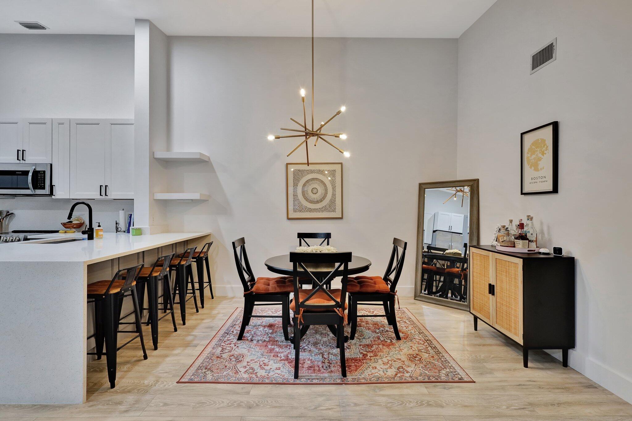 13851 Oneida Drive, Unit B2 Delray Beach, FL 33446 - Photo 8 of 30 a view of a dining room with furniture and wooden floor