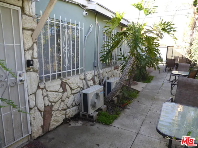 a view of a house with a tree