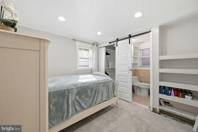 a bedroom with a bed and a cabinets