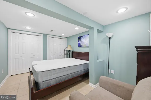 a room with a bed and a chandelier