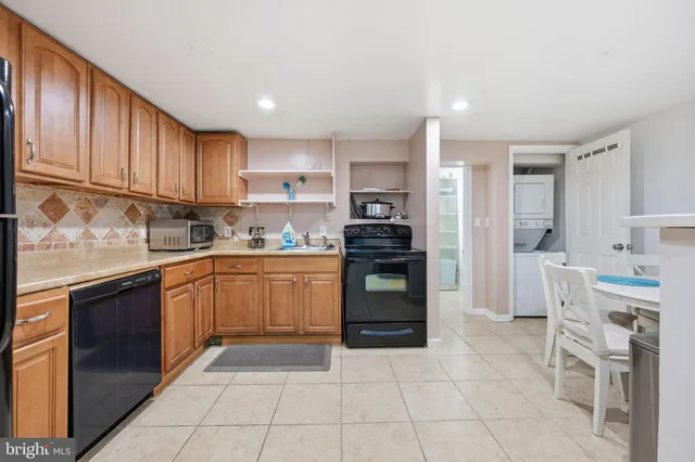 a kitchen with cabinets and appliances