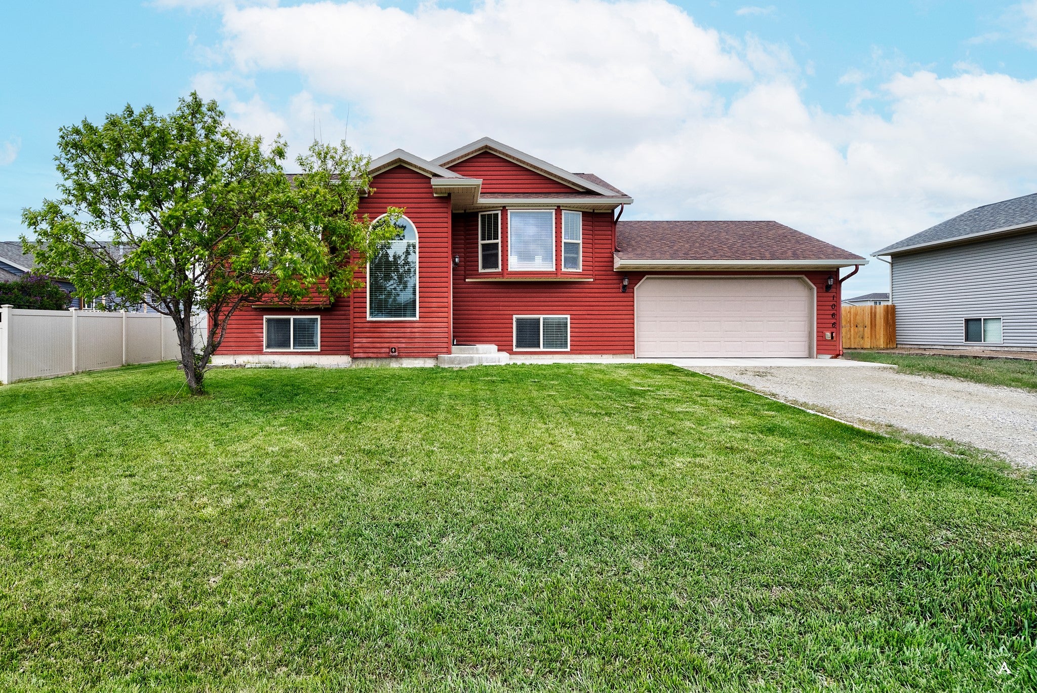 1066 Antares Road Helena, MT 59602 - Photo 1 of 1 View of front of property featuring driveway, an attached garage, and roof with shingles