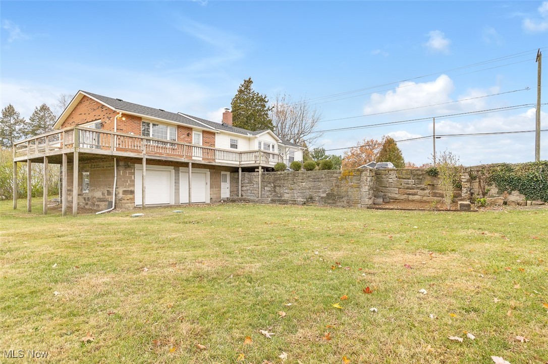 43800 Middle Ridge Road Lorain, OH 44053 - Photo 28 of 31 View of grassy yard featuring a deck and a garage