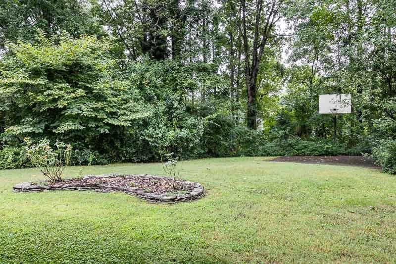 602 Wofford Road Durham, NC 27707 - Photo 21 of 26 Large lot with mature trees and basketball pad. Backyard