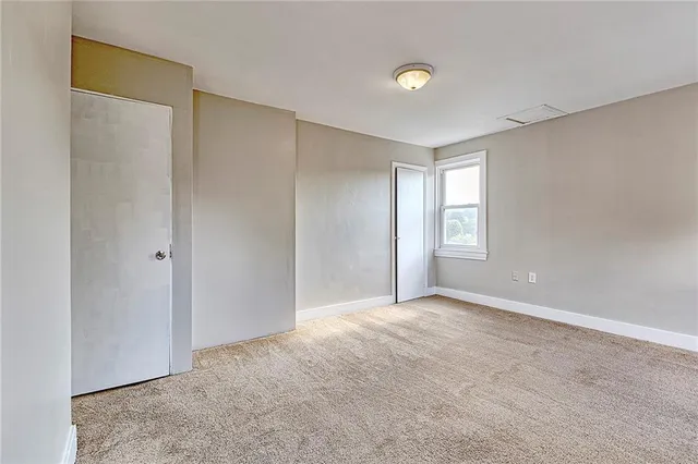 a view of an empty room and window