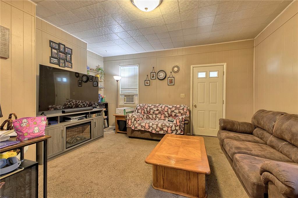 108 Pandora Road Loyalhanna, PA 15661 - Photo 15 of 23 a bedroom with a bed and a flat screen tv