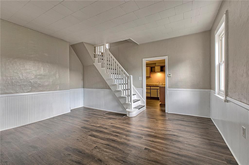 108 Pandora Road Loyalhanna, PA 15661 - Photo 5 of 23 a view of an empty room with wooden floor and a window
