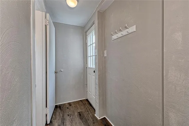 a view of a livingroom with wooden floor