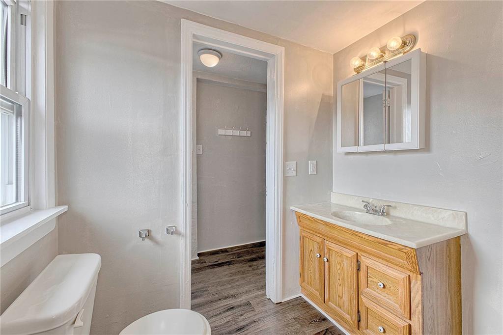 108 Pandora Road Loyalhanna, PA 15661 - Photo 8 of 23 a bathroom with a sink a toilet a mirror and shower