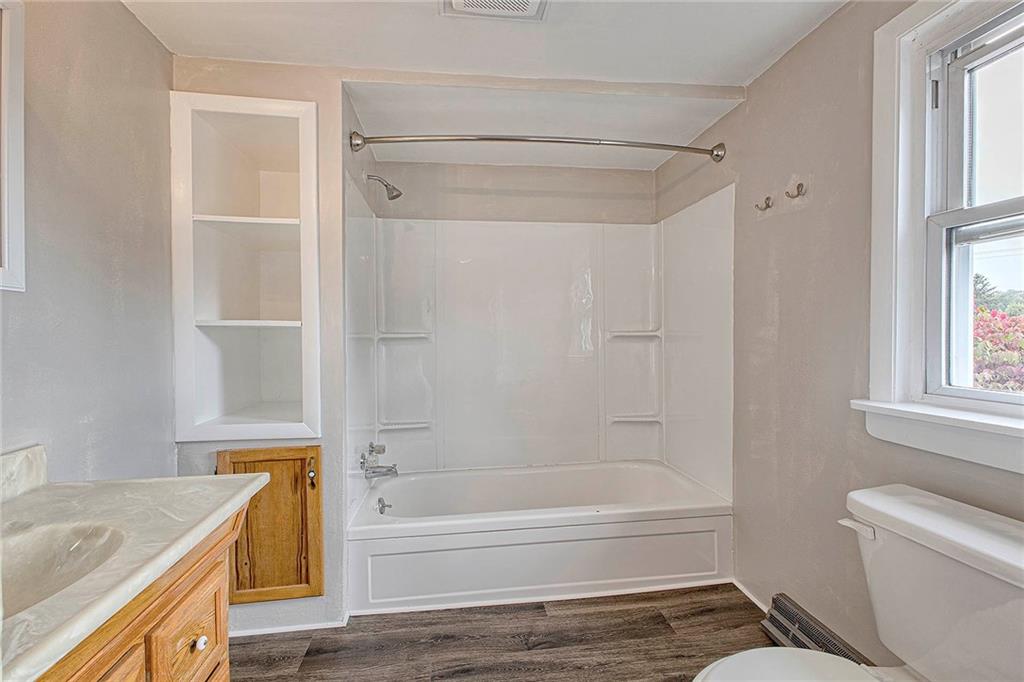 108 Pandora Road Loyalhanna, PA 15661 - Photo 9 of 23 a bathroom with a granite countertop bathtub shower sink vanity and toilet