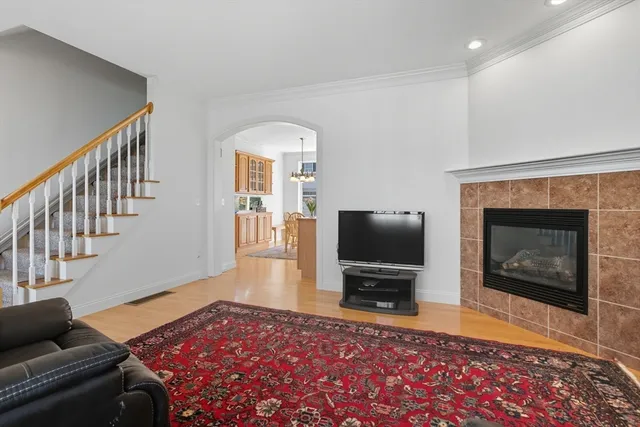 a living room with furniture flat screen tv and a fireplace