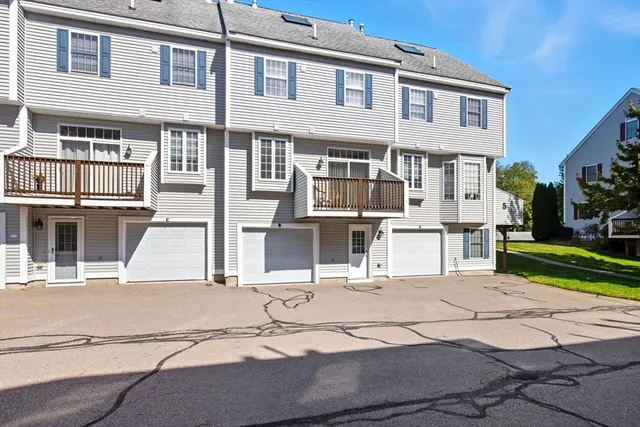 a view of a white building among the street