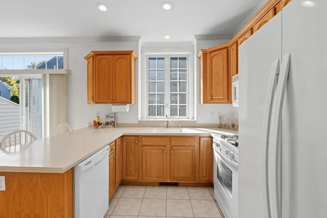 a kitchen with a sink stove and refrigerator