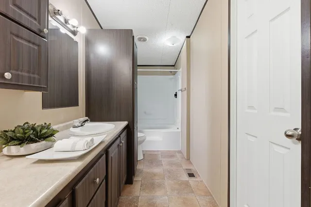 a bathroom with a sink a shower and a mirror