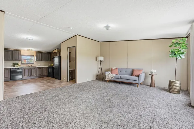 a living room with furniture and a table