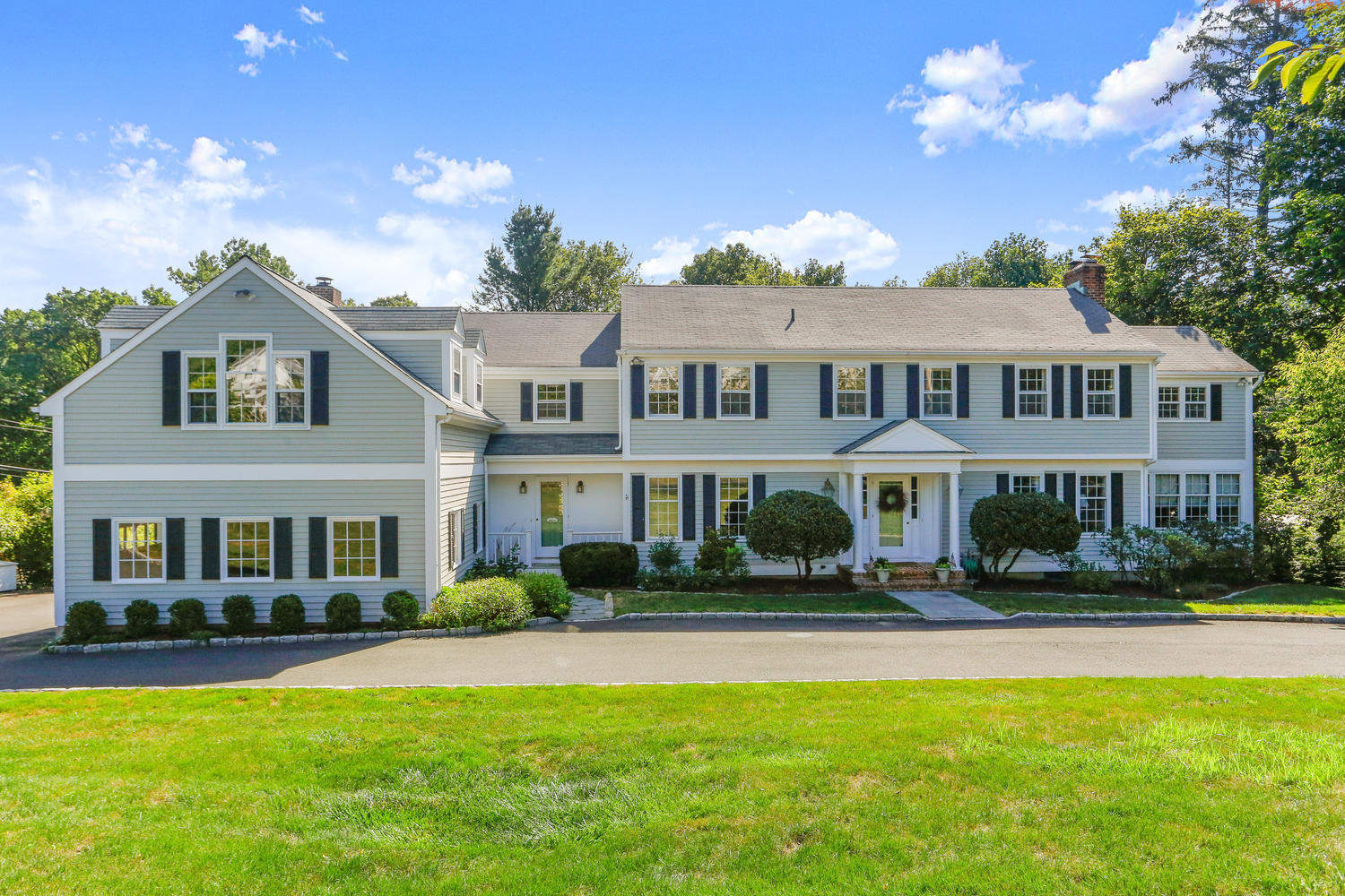 116 Marshall Ridge Road New Canaan, CT 06840 - Photo 1 of 50 a front view of a house with a yard