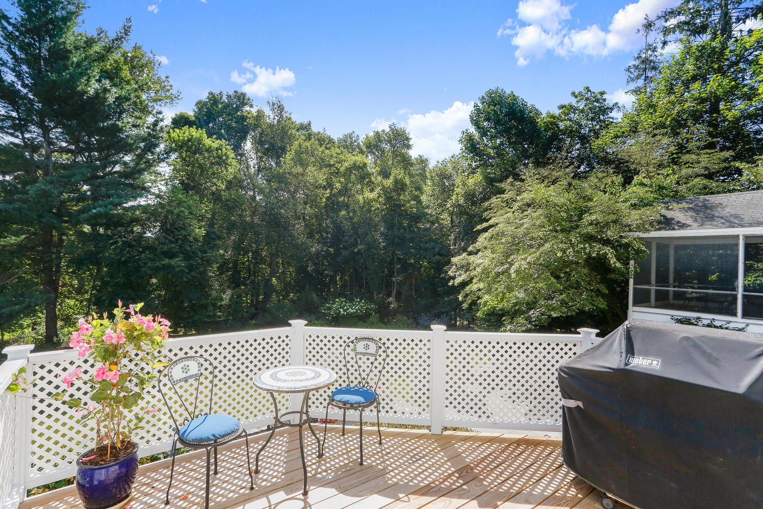 116 Marshall Ridge Road New Canaan, CT 06840 - Photo 12 of 50 a view of a patio with couches table and chairs and potted plants