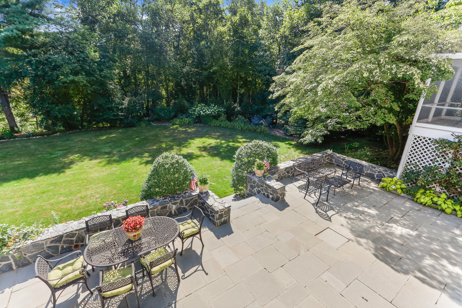 116 Marshall Ridge Road New Canaan, CT 06840 - Photo 13 of 50 a backyard of a house with yard table and chairs