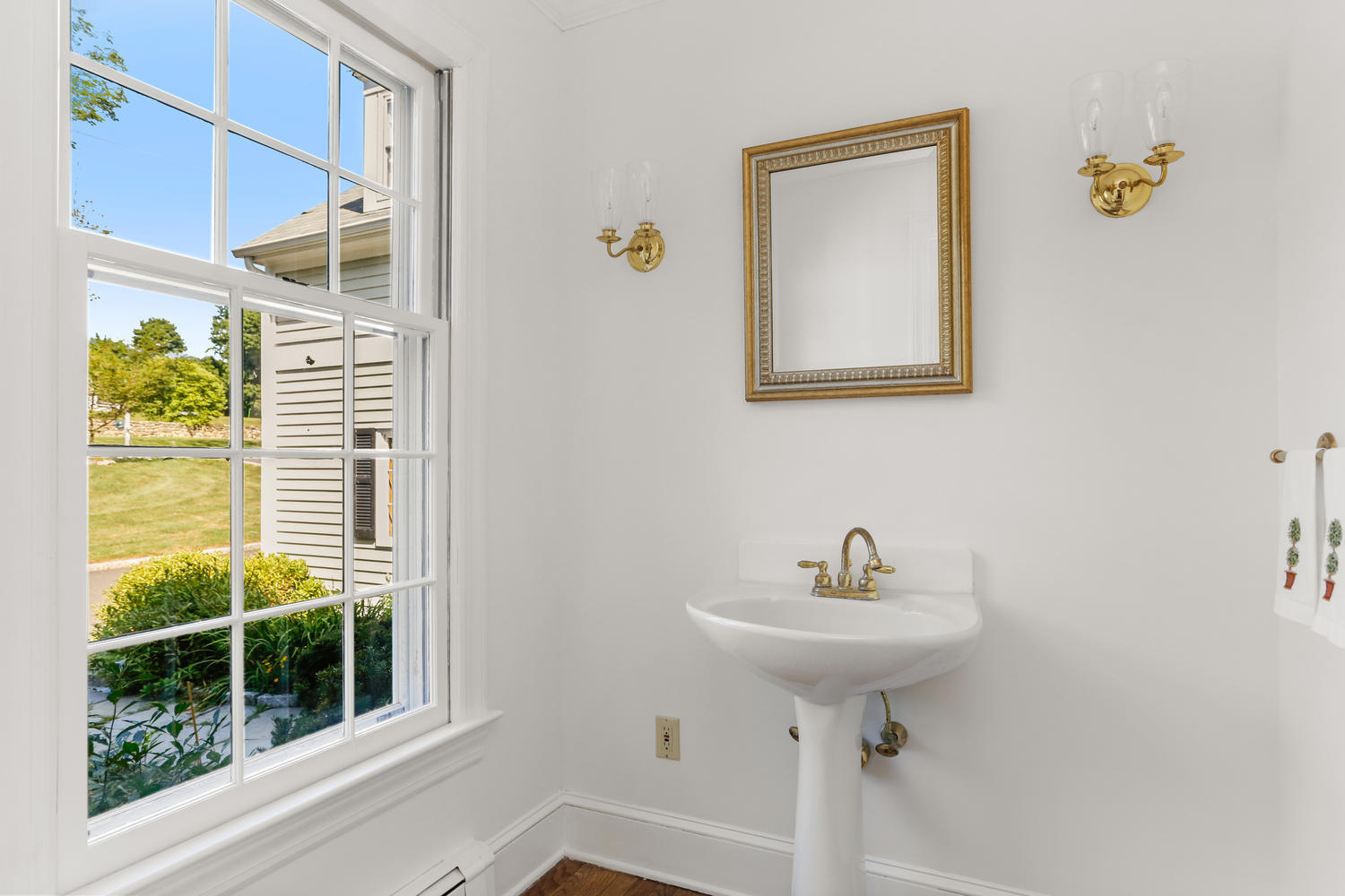 116 Marshall Ridge Road New Canaan, CT 06840 - Photo 17 of 50 a bathroom with a sink and a mirror