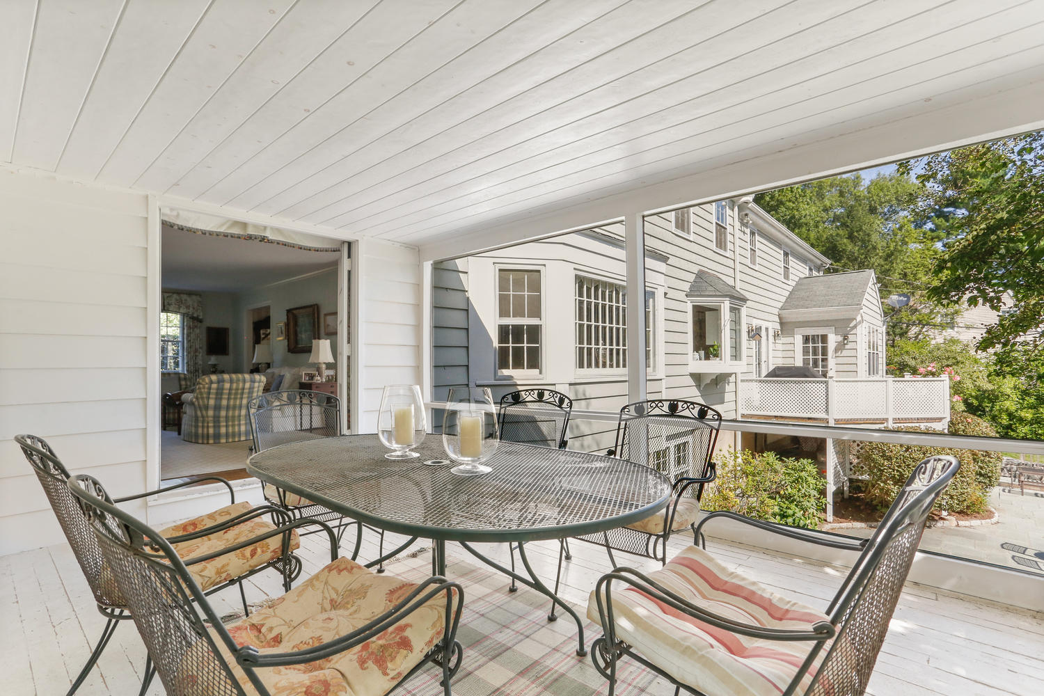 116 Marshall Ridge Road New Canaan, CT 06840 - Photo 23 of 50 a view of a patio with table and chairs