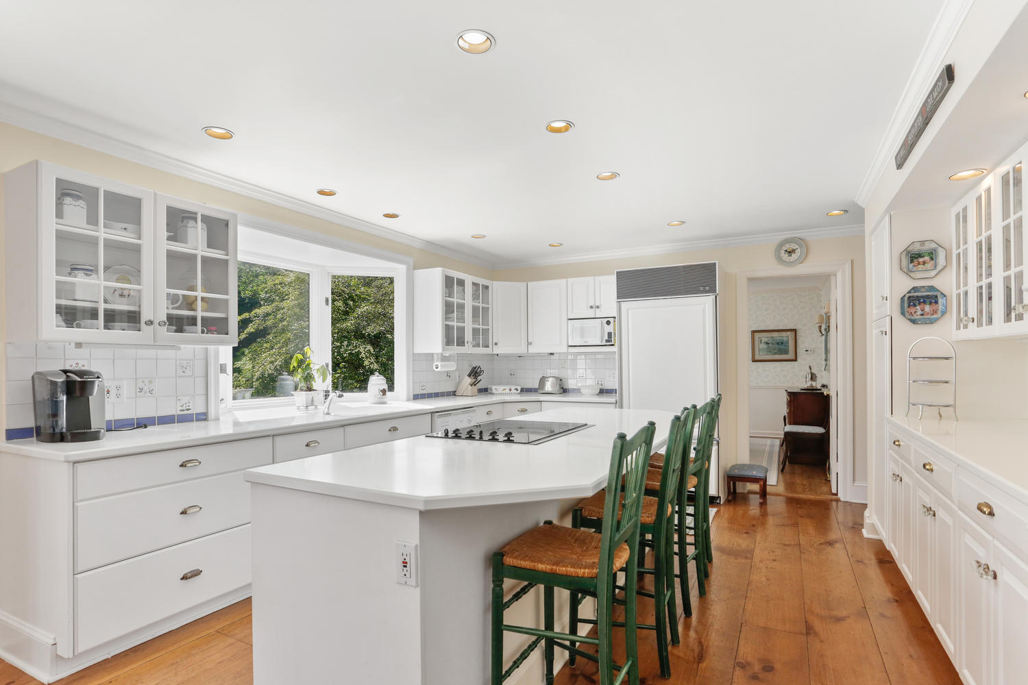 116 Marshall Ridge Road New Canaan, CT 06840 - Photo 28 of 50 a kitchen with stainless steel appliances kitchen island granite countertop a table and chairs in it