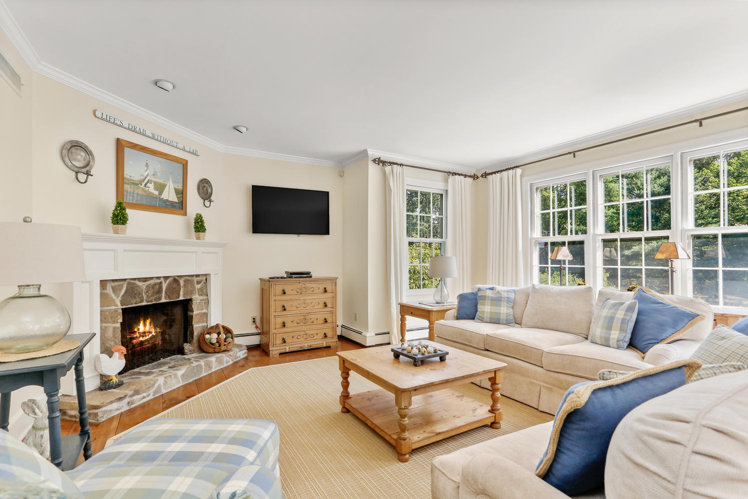 116 Marshall Ridge Road New Canaan, CT 06840 - Photo 30 of 50 a living room with furniture and a fireplace