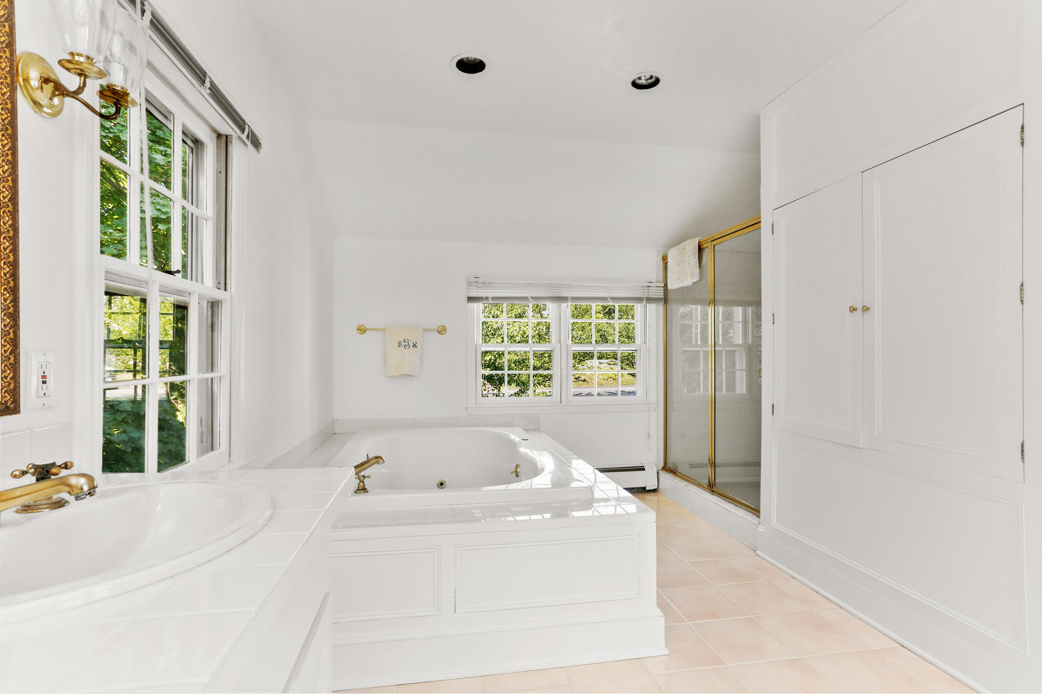 116 Marshall Ridge Road New Canaan, CT 06840 - Photo 38 of 50 a bath tub sitting in a bathroom next to a window