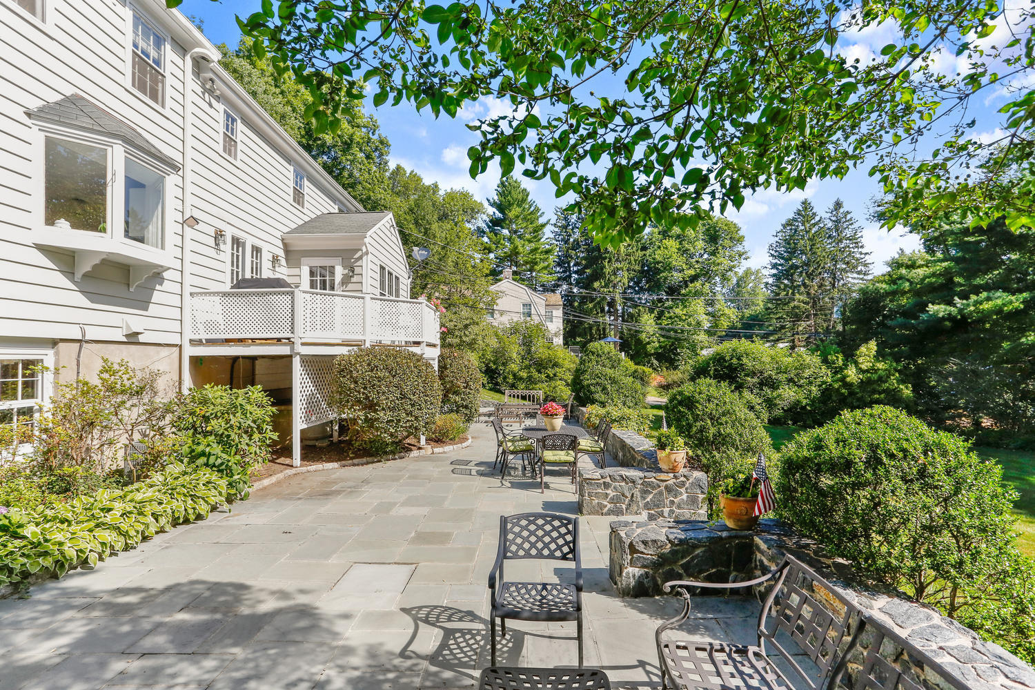 116 Marshall Ridge Road New Canaan, CT 06840 - Photo 7 of 50 a view of a patio with table and chairs and potted plants