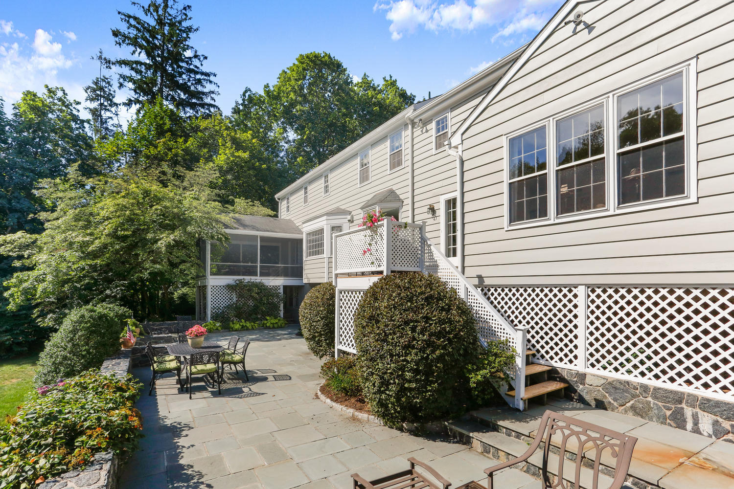 116 Marshall Ridge Road New Canaan, CT 06840 - Photo 9 of 50 a front view of a house with a garden